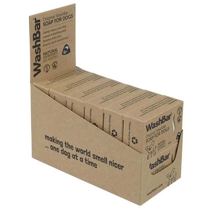 Display of multiple WashBar Original Soap bars stacked in kraft display case – sustainable dog grooming solution.