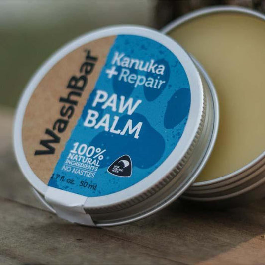 Opened WashBar Paw Balm tin displaying creamy balm – soothing paw salve for cracked or dry paw pads